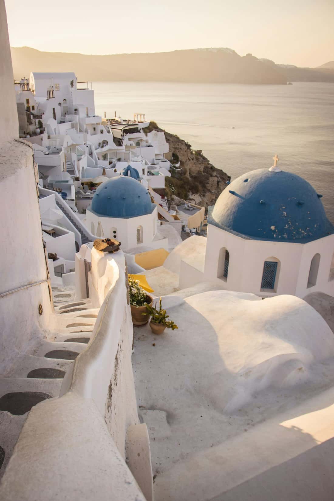 White and blue domed churches above the sea at Oia, Santorini